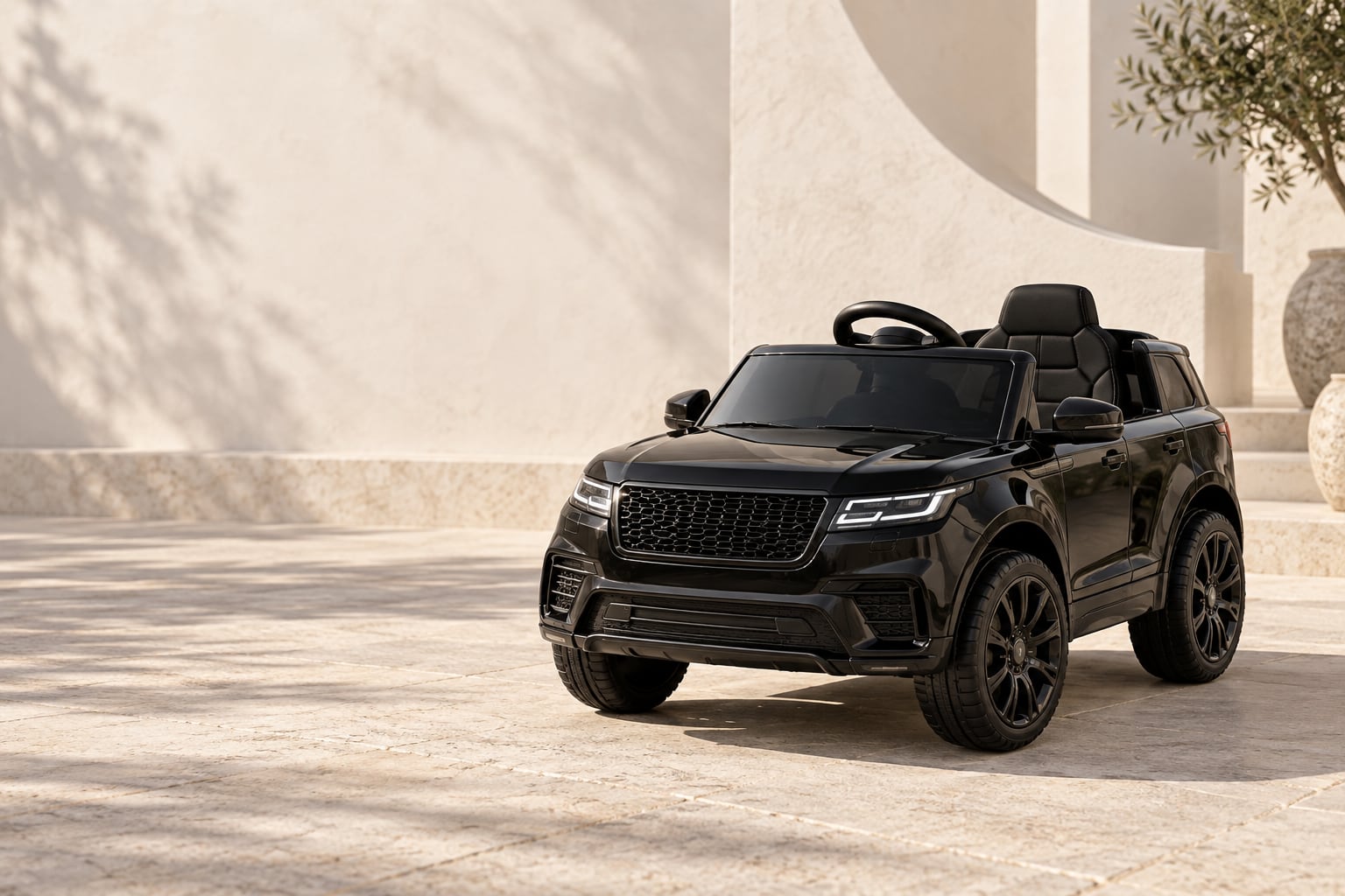 Concept image of a black child-sized electric ride-on car in a sunlit courtyard