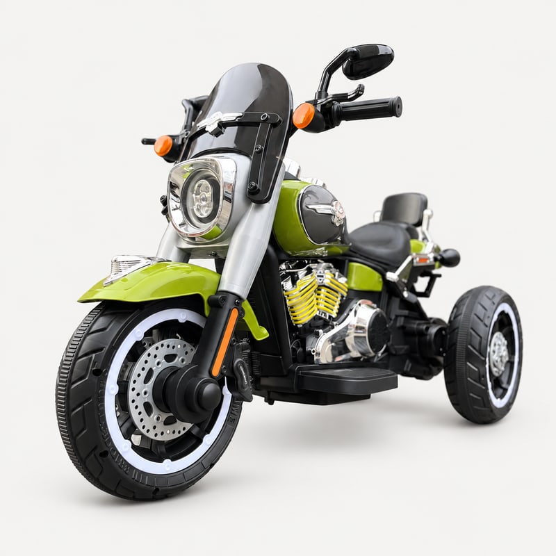 Country cruiser powerbike — Green electric ride-on, front three-quarter, on a light-grey background.