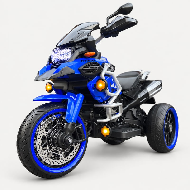 GS powerbike — Blue electric ride-on, front three-quarter, on a light-grey background.