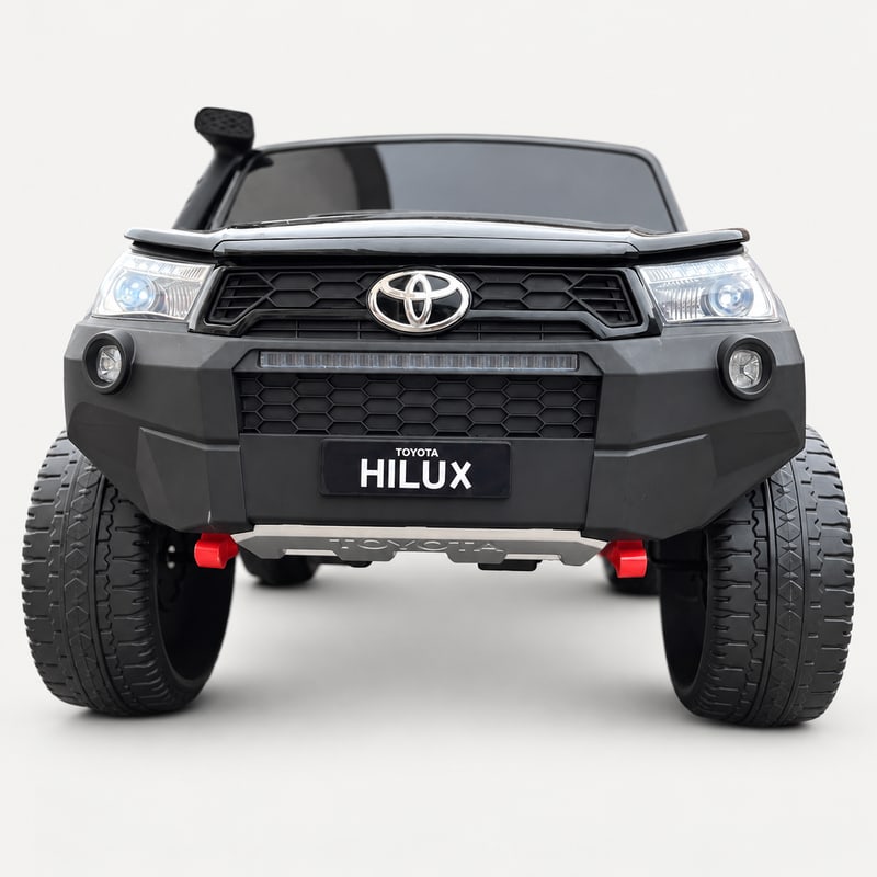 Kids Hilux Rugged X — Black electric ride-on, front view, on a light-grey background.